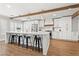 Bright, modern kitchen with white cabinets, a large island, and stainless steel appliances at 8820 Fall Green Ave, Las Vegas, NV 89129