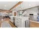 Well-designed kitchen with a large island, stainless steel appliances, and wood beam accents at 8820 Fall Green Ave, Las Vegas, NV 89129