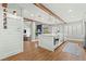 Modern kitchen featuring white cabinets, countertops, a large island, and stainless appliances at 8820 Fall Green Ave, Las Vegas, NV 89129