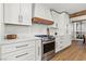 A modern kitchen features white cabinets, quartz countertops, and stainless steel appliances at 8820 Fall Green Ave, Las Vegas, NV 89129