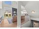 Open floor plan showcasing the living room and staircase with views of the well-equipped kitchen at 8820 Fall Green Ave, Las Vegas, NV 89129