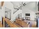 Open-concept living room with a soaring ceiling, comfortable seating, and a large tv at 8820 Fall Green Ave, Las Vegas, NV 89129