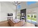Bright living room with a cozy fireplace, lots of natural light, and comfortable seating at 8820 Fall Green Ave, Las Vegas, NV 89129