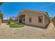Backyard featuring a low-maintenance rock landscape and synthetic grass at 9252 Oxbow Lake Ave, Las Vegas, NV 89149