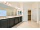 Bathroom features a double vanity, large mirror, walk-in closet, and separate shower at 9252 Oxbow Lake Ave, Las Vegas, NV 89149