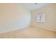 Comfortable carpeted bedroom with neutral paint and a window providing natural light at 9252 Oxbow Lake Ave, Las Vegas, NV 89149