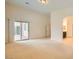 Bright Primary bedroom with sliding glass door and en-suite bathroom entrance at 9252 Oxbow Lake Ave, Las Vegas, NV 89149