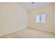 Cozy carpeted bedroom with neutral paint and a window providing natural light at 9252 Oxbow Lake Ave, Las Vegas, NV 89149