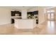 Open kitchen with dark cabinets, granite countertops, and stainless steel appliances at 9252 Oxbow Lake Ave, Las Vegas, NV 89149