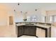 Kitchen features granite countertops, stainless steel appliances, and a breakfast bar at 9252 Oxbow Lake Ave, Las Vegas, NV 89149