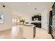 Bright, open kitchen with black cabinets, granite countertops, and modern appliances at 9252 Oxbow Lake Ave, Las Vegas, NV 89149