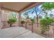 Spacious covered patio featuring a ceiling fan, landscaped views, and plenty of room to relax and entertain at 9424 Gold Mountain Dr, Las Vegas, NV 89134