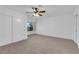 A bright bedroom features carpeted floors, a ceiling fan, and a window at 9424 Gold Mountain Dr, Las Vegas, NV 89134