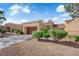 Charming one-story home features an attached garage, desert landscaping, and a well-maintained exterior at 9424 Gold Mountain Dr, Las Vegas, NV 89134