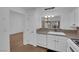 Open kitchen layout with modern white appliances and a large sink at 9424 Gold Mountain Dr, Las Vegas, NV 89134