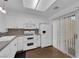 Well-lit kitchen features white cabinetry and stainless steel appliances at 9424 Gold Mountain Dr, Las Vegas, NV 89134