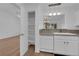 Updated kitchen area featuring a built in pantry and modern appliances at 9424 Gold Mountain Dr, Las Vegas, NV 89134