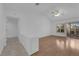 Bright living room with wood floors, a ceiling fan, large windows, and neutral walls at 9424 Gold Mountain Dr, Las Vegas, NV 89134