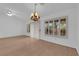 Bright living room with hardwood floors, chandelier, and large windows at 9424 Gold Mountain Dr, Las Vegas, NV 89134