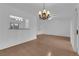 Bright living room with hardwood floors and decorative chandelier at 9424 Gold Mountain Dr, Las Vegas, NV 89134