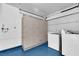 A utility room features storage cabinets, as well as hook ups for a washer and dryer at 9424 Gold Mountain Dr, Las Vegas, NV 89134