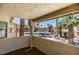 Balcony overlooking pool, landscaping, and covered parking at 1013 Falconhead Ln # 202, Las Vegas, NV 89128