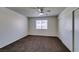 Neutral bedroom features a ceiling fan, closet, and a window for natural light at 1013 Falconhead Ln # 202, Las Vegas, NV 89128