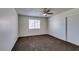 Neutral bedroom features a ceiling fan, and a window for natural light at 1013 Falconhead Ln # 202, Las Vegas, NV 89128