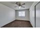 Bedroom features neutral walls, ceiling fan, and closet storage space at 1013 Falconhead Ln # 202, Las Vegas, NV 89128