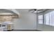 Kitchen area with white appliances and connecting to the living space at 1013 Falconhead Ln # 202, Las Vegas, NV 89128