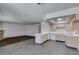 Bright, open layout integrating the kitchen and living area with neutral tones at 1013 Falconhead Ln # 202, Las Vegas, NV 89128
