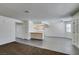 Open concept living space featuring tile floors and connecting kitchen at 1013 Falconhead Ln # 202, Las Vegas, NV 89128