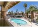 Balcony overlooking a pool and beautiful desert landscaping at 1013 Falconhead Ln # 202, Las Vegas, NV 89128