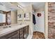 Contemporary bathroom with double sinks and framed mirror at 10312 Glimmering Star Dr, Las Vegas, NV 89178