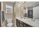 Modern bathroom featuring double sinks, vanity lighting, and ample counter space at 10312 Glimmering Star Dr, Las Vegas, NV 89178