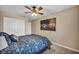 Relaxing bedroom featuring a ceiling fan and artwork at 10312 Glimmering Star Dr, Las Vegas, NV 89178