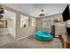 Comfortable bedroom with a stylish ceiling fan and a plush beanbag chair at 10312 Glimmering Star Dr, Las Vegas, NV 89178