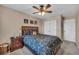 Comfortable bedroom featuring a wood headboard and framed artwork at 10312 Glimmering Star Dr, Las Vegas, NV 89178