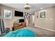 Spacious bedroom with a stylish ceiling fan and a plush beanbag chair at 10312 Glimmering Star Dr, Las Vegas, NV 89178