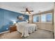Tranquil bedroom featuring an accent wall and plantation shutters at 10312 Glimmering Star Dr, Las Vegas, NV 89178