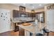 Kitchen with stainless steel appliances, granite countertops, and breakfast bar seating at 10312 Glimmering Star Dr, Las Vegas, NV 89178