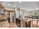 Bright, open kitchen with stainless appliances, granite counters, and a connected living area at 10312 Glimmering Star Dr, Las Vegas, NV 89178