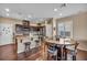 Eat-in kitchen features granite countertops, stainless steel appliances, and hardwood floors at 10312 Glimmering Star Dr, Las Vegas, NV 89178