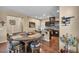 Kitchen with an island and stainless appliances, flowing into an open-concept living space at 10312 Glimmering Star Dr, Las Vegas, NV 89178