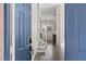 Inviting entryway with hardwood floors and a staircase leading to the upper level at 11484 Roncat Ct, Las Vegas, NV 89141