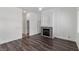 Bright living room featuring a stone fireplace and modern flooring at 11484 Roncat Ct, Las Vegas, NV 89141