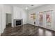 Inviting living room with a fireplace and access to outdoor patio at 11484 Roncat Ct, Las Vegas, NV 89141