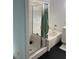 Bathroom featuring a shower-tub combo with glass enclosure, tiled walls and modern fixtures at 1525 Spiced Wine Ave # 14101, Henderson, NV 89074