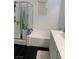 Bathroom featuring a shower-tub combo with glass enclosure, tiled walls and modern fixtures at 1525 Spiced Wine Ave # 14101, Henderson, NV 89074