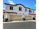 Inviting townhome featuring attached garages and well-maintained landscaping at 1525 Spiced Wine Ave # 14101, Henderson, NV 89074